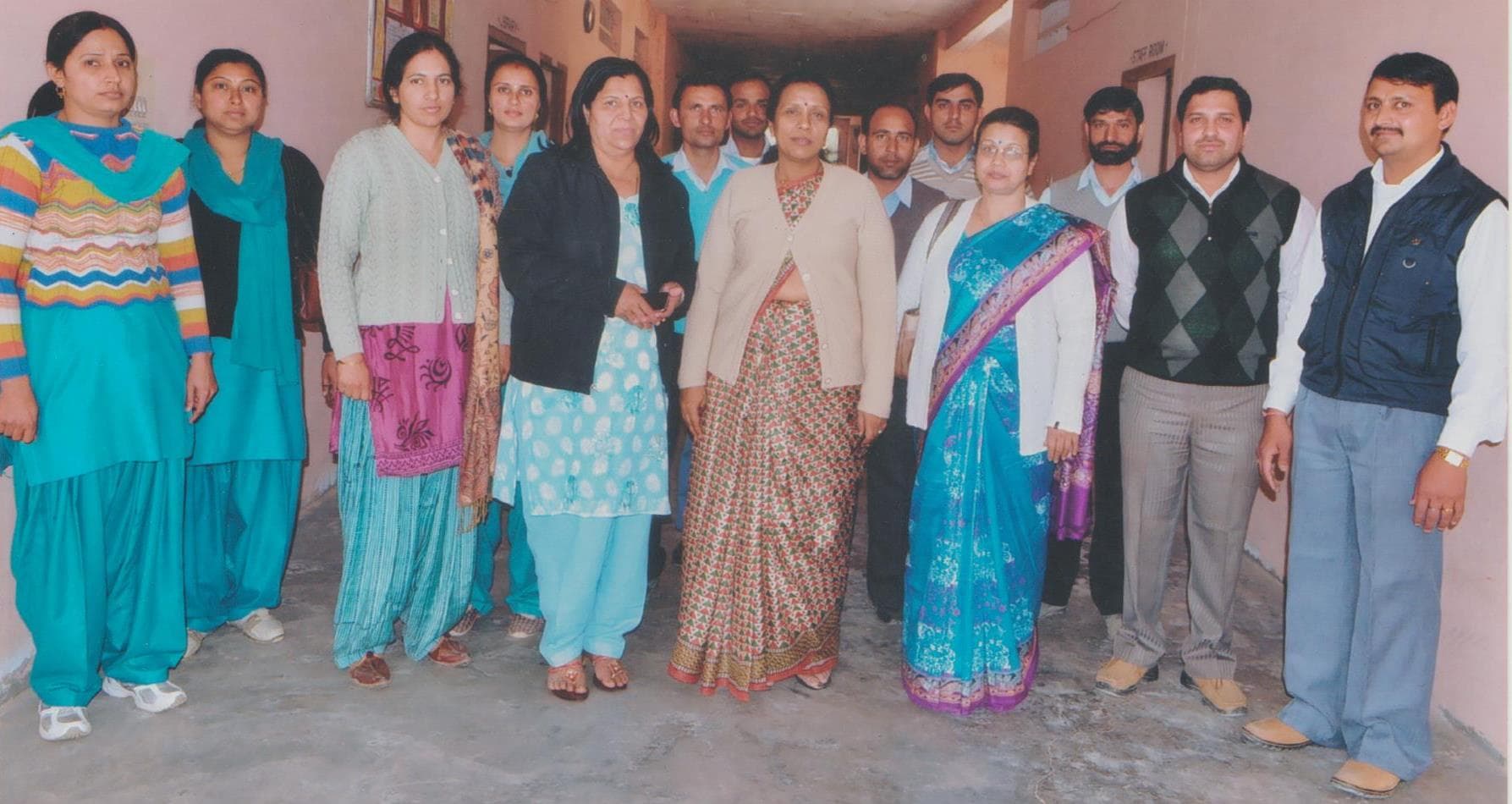 Inspection team and staff, group photo in the corridor near the staff room